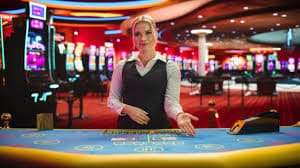 Live dealer at Casino Hold'em table on bustogel link
